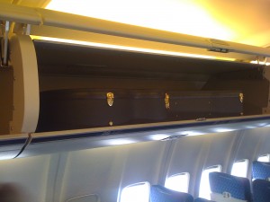 Just had to document this: I've got two Taylor 814ce's in hard cases in one overhead bin with room to spare on a 757. Doesn't fit, huh? Hmmph!