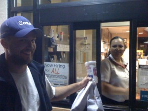 A few hours later... Rayner picking up our take-out meal on the tandem at the McDonald's drive-thru windo. This lady must have thought we were crazy.